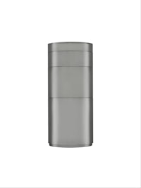 a stainless steel canister on a white background